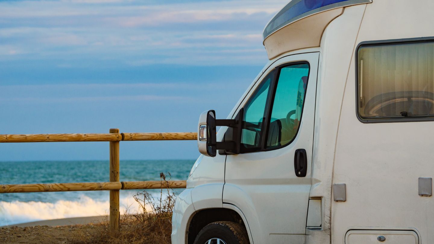Lineup of different RV types including motorhomes, trailers, and camper vans